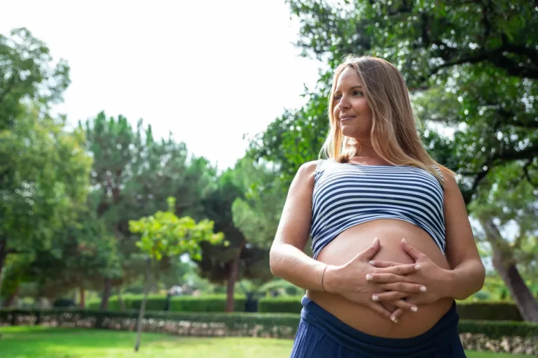 pregnant girl crossing her hands in the gut 2023 11 27 05 02 06 utc